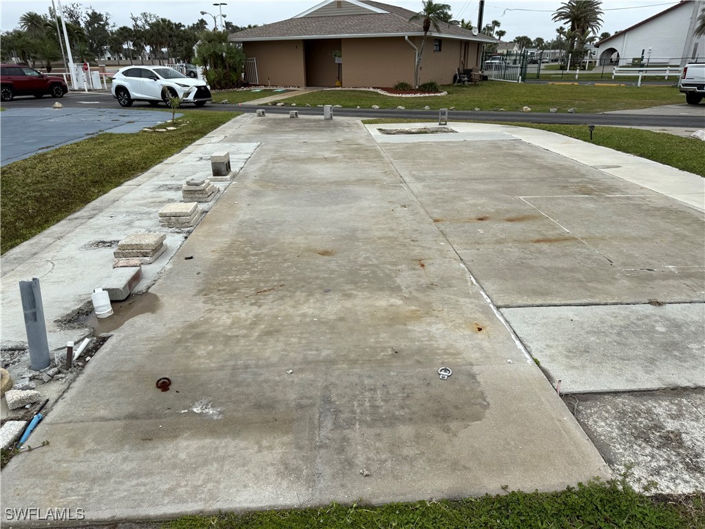 19681 Summerlin Road, Unit 545 Fort Myers, FL 33908 - Photo 2 of 8 a view of a street with a cars parked