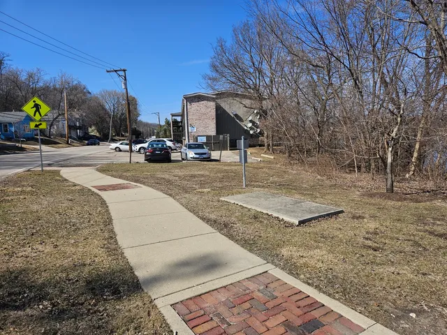 a view of a yard with a car parked