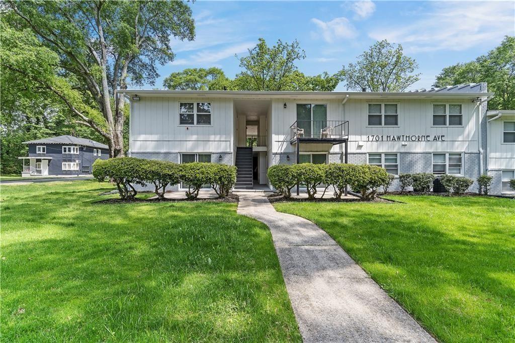 1701 Hawthorne Avenue, Unit 9 Atlanta, GA 30337 - Photo 1 of 16 a front view of house with yard and green space