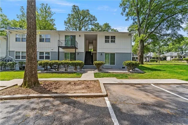 a view of a house with swimming pool and a yard