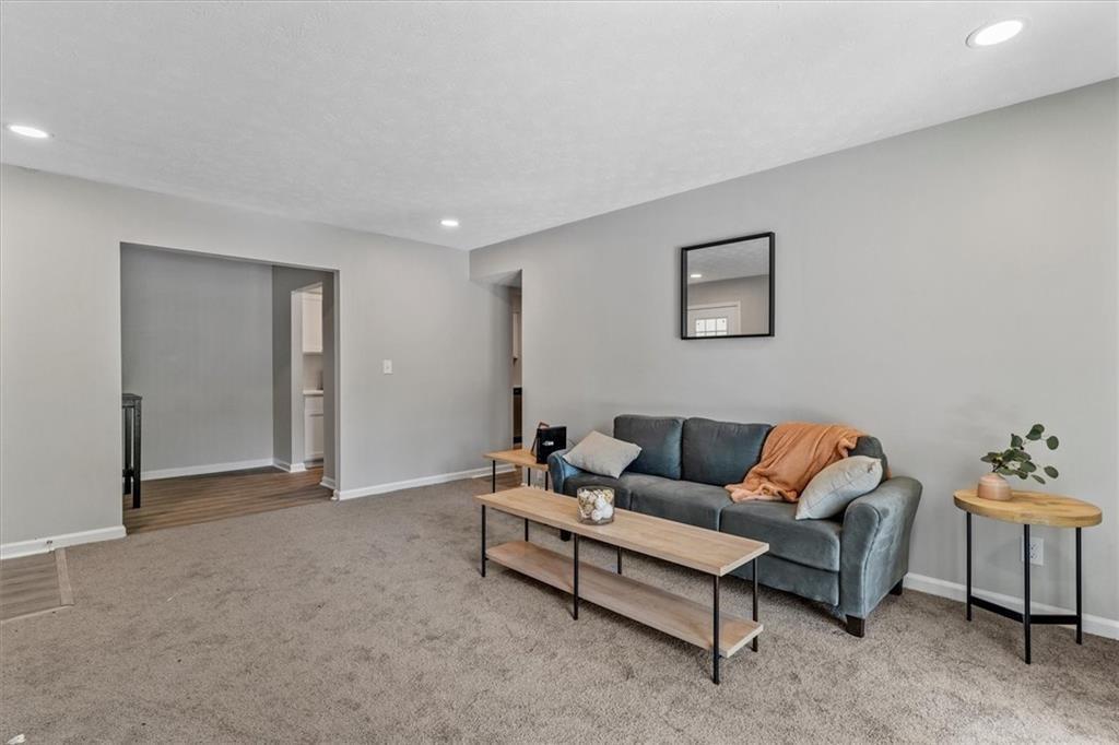 1701 Hawthorne Avenue, Unit 9 Atlanta, GA 30337 - Photo 5 of 16 a living room with furniture and a window