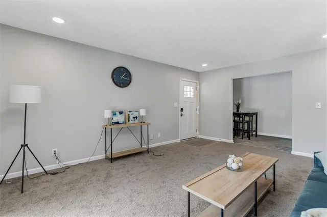 a kitchen with white cabinets and appliances