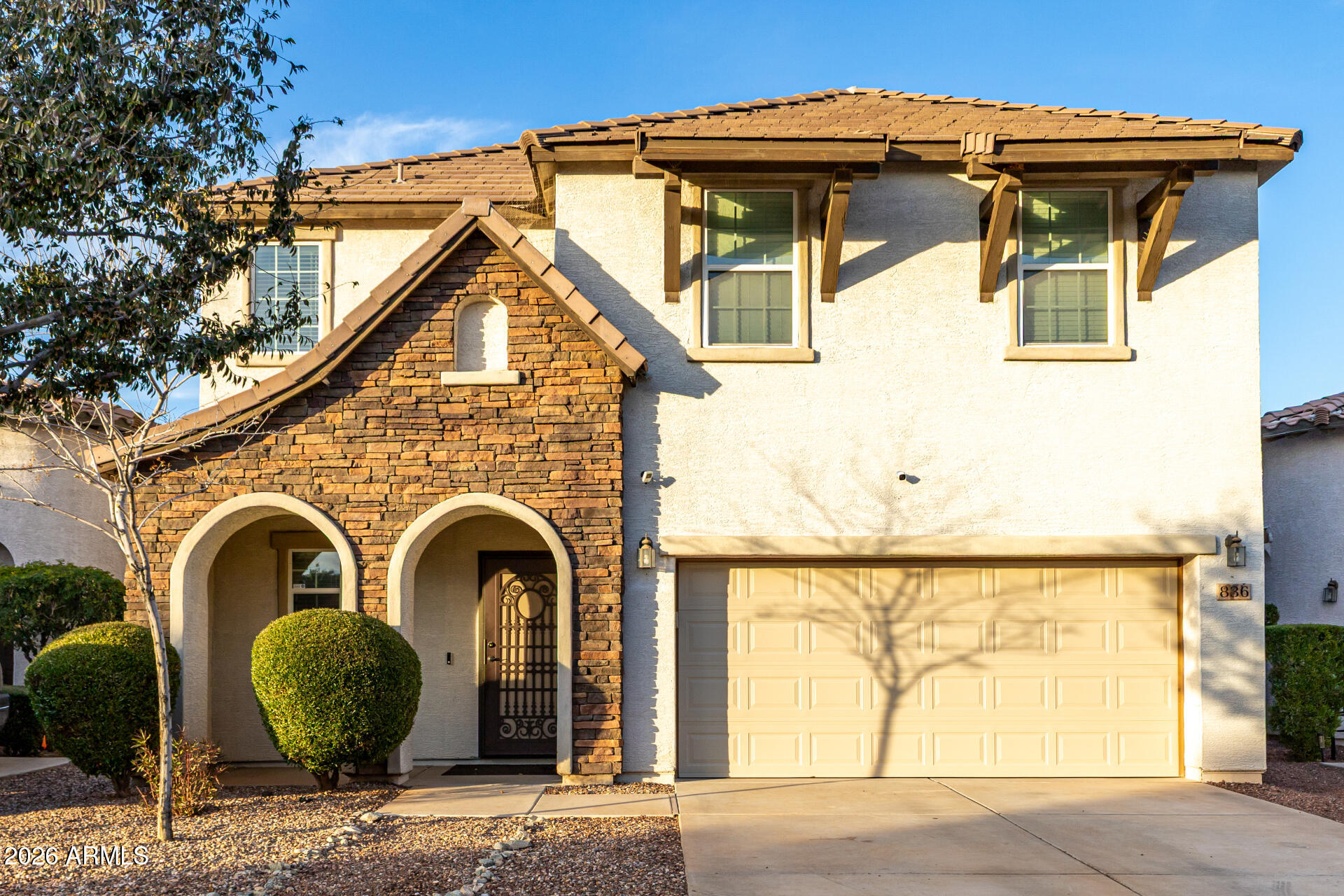 836 Constance Way Phoenix, AZ 85042 - Photo 2 of 51 a front view of a house with garden