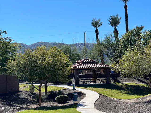 a view of a park with swings and slides