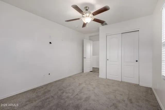 a swimming pool with lots of tress in the background