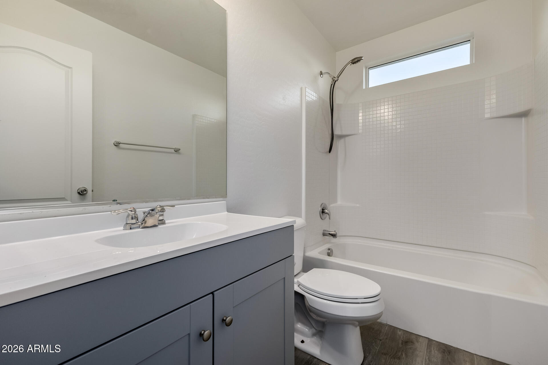836 Constance Way Phoenix, AZ 85042 - Photo 27 of 51 a bathroom with a sink a toilet and a mirror