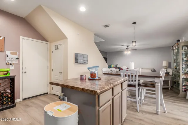 a kitchen with a table and chairs in it