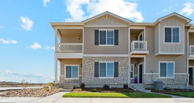 a front view of a house with yard