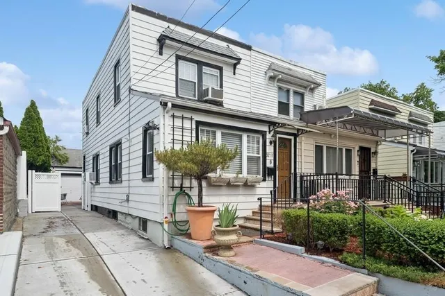 a backyard of a house with outdoor seating