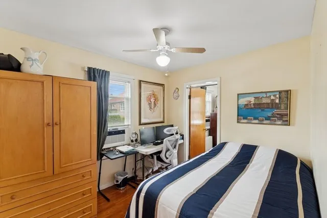 a bedroom with a bed and a table in it