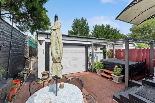 a view of house with a patio and furniture