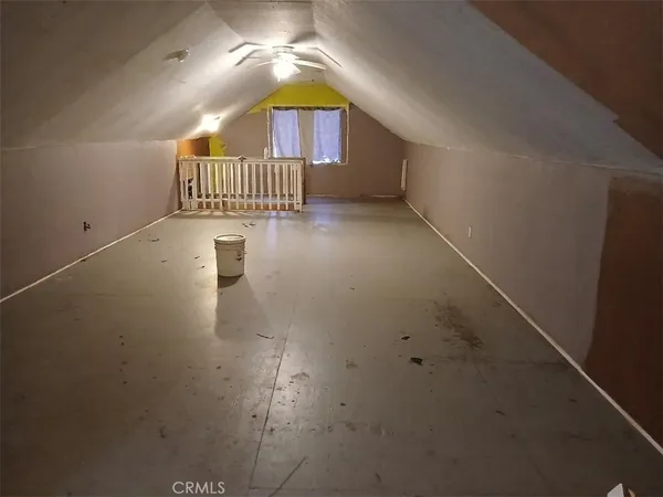 a view of a hallway with a room