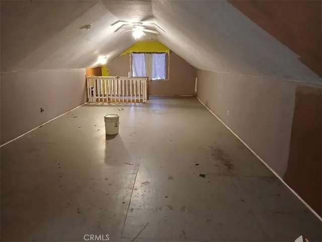 a view of a hallway with a room