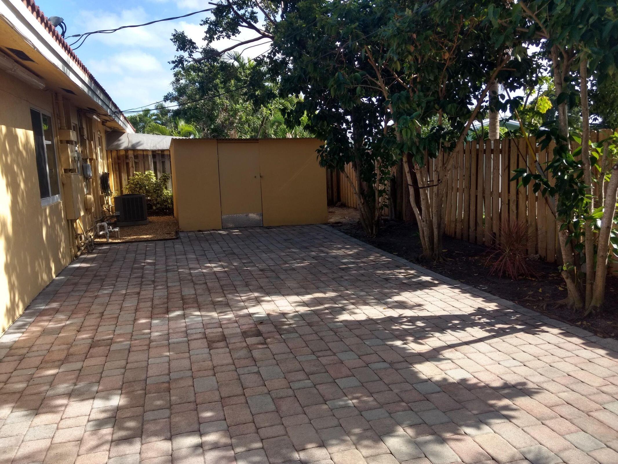 2210 Northeast 36th Street, Unit A&B Lighthouse Point, FL 33064 - Photo 20 of 25 patio and storage