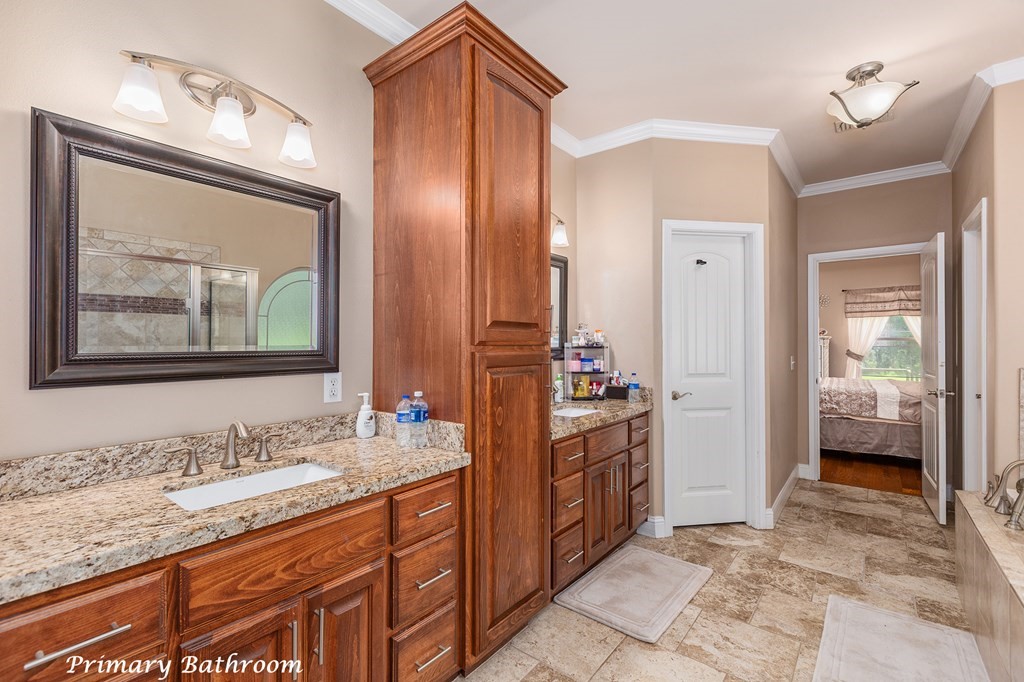 1171 Old Ewing Road Lufkin, TX 75901 - Photo 18 of 49 a spacious bathroom with a granite countertop sink mirror and a