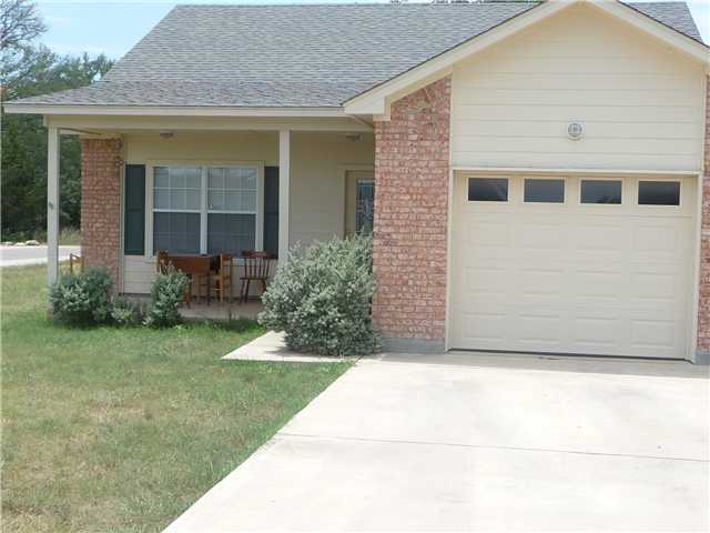 a view of house with backyard