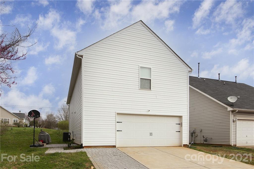 4615 David Cox Road Charlotte, NC 28269 - Photo 19 of 20 a view of a house with a yard