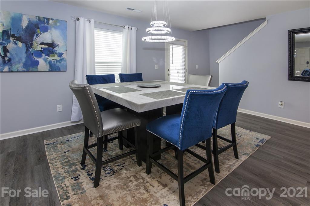 4615 David Cox Road Charlotte, NC 28269 - Photo 6 of 20 a view of a dining room with furniture and window