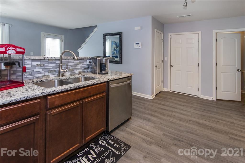 4615 David Cox Road Charlotte, NC 28269 - Photo 10 of 20 a kitchen with sink and cabinets