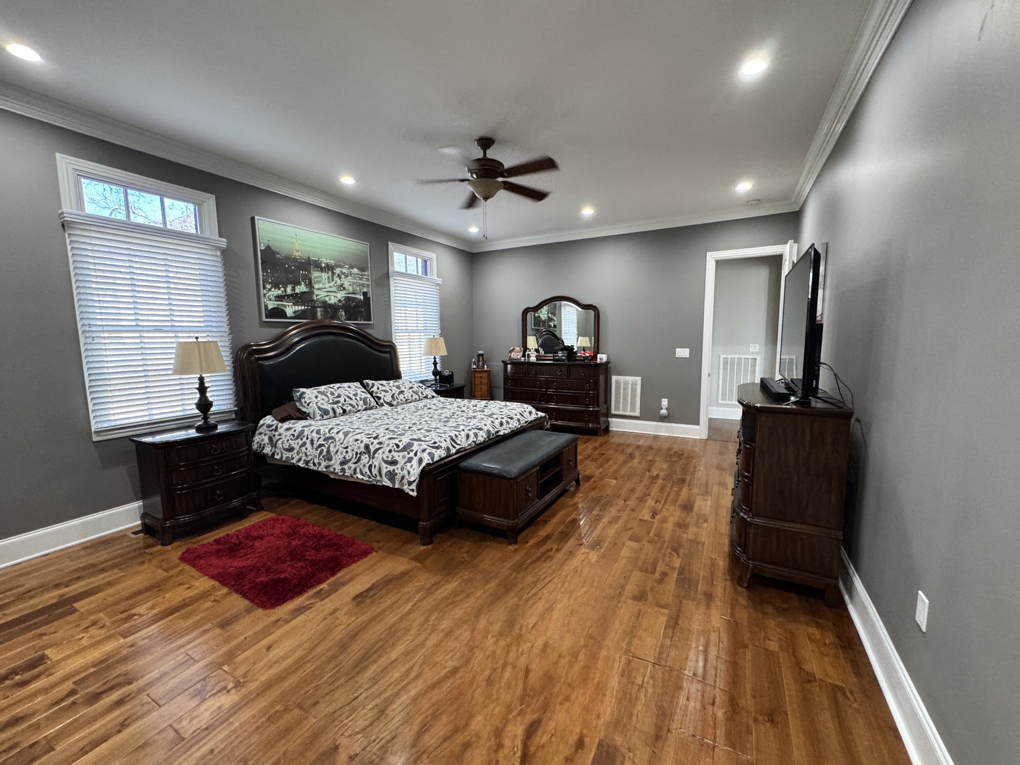 7402 Cold Harbor Court Fairview, TN 37062 - Photo 16 of 48 a bedroom with a bed and wooden floor