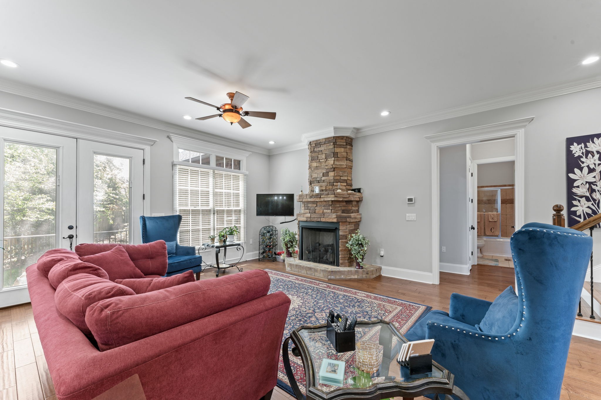 7402 Cold Harbor Court Fairview, TN 37062 - Photo 24 of 48 a living room with furniture a fireplace and a large window