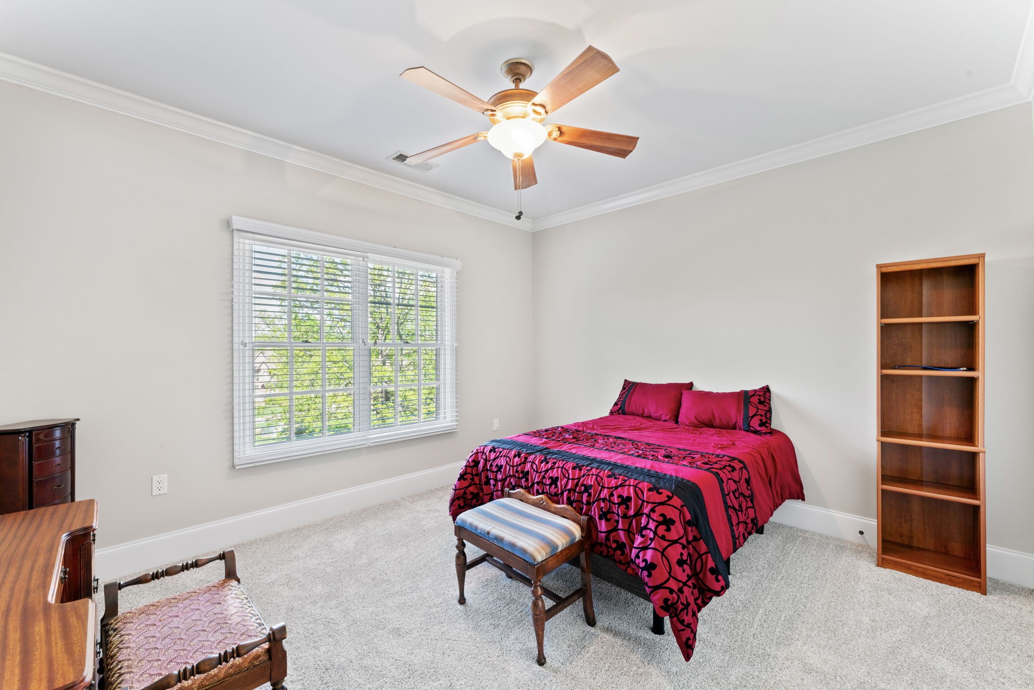 7402 Cold Harbor Court Fairview, TN 37062 - Photo 30 of 48 a bedroom with a bed and a chandelier
