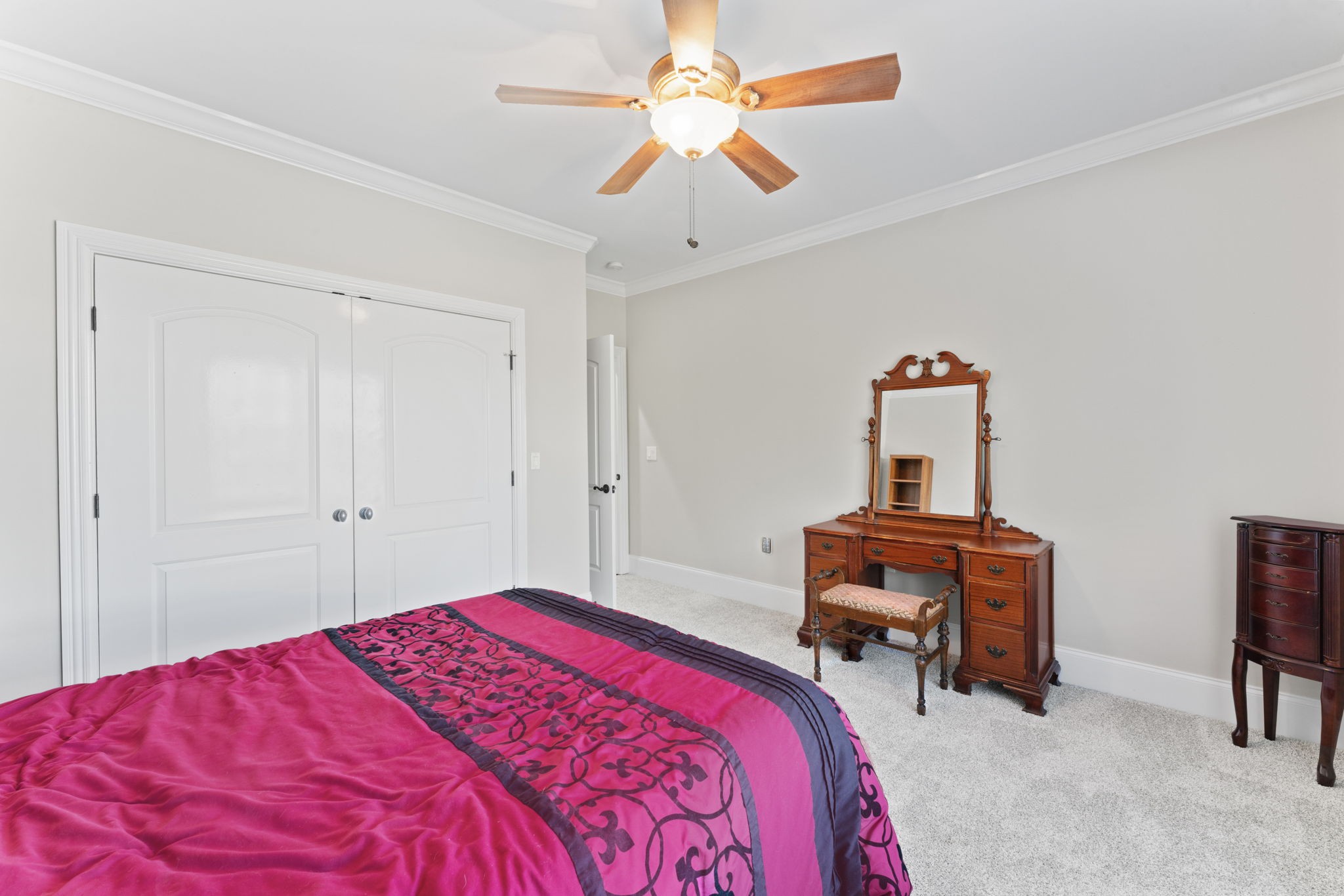 7402 Cold Harbor Court Fairview, TN 37062 - Photo 31 of 48 a bedroom with a bed and a chandelier
