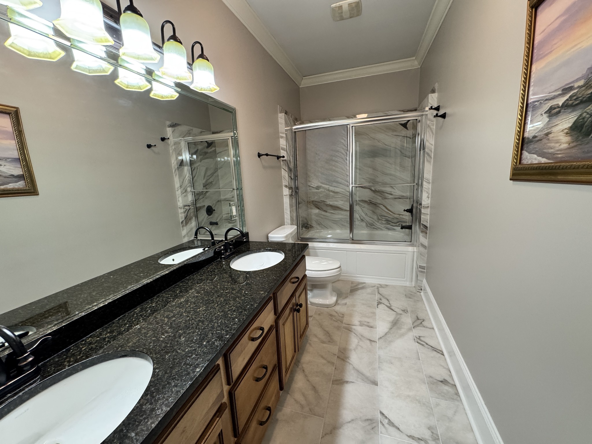 7402 Cold Harbor Court Fairview, TN 37062 - Photo 32 of 48 a bathroom with a granite countertop sink a toilet a mirror and shower