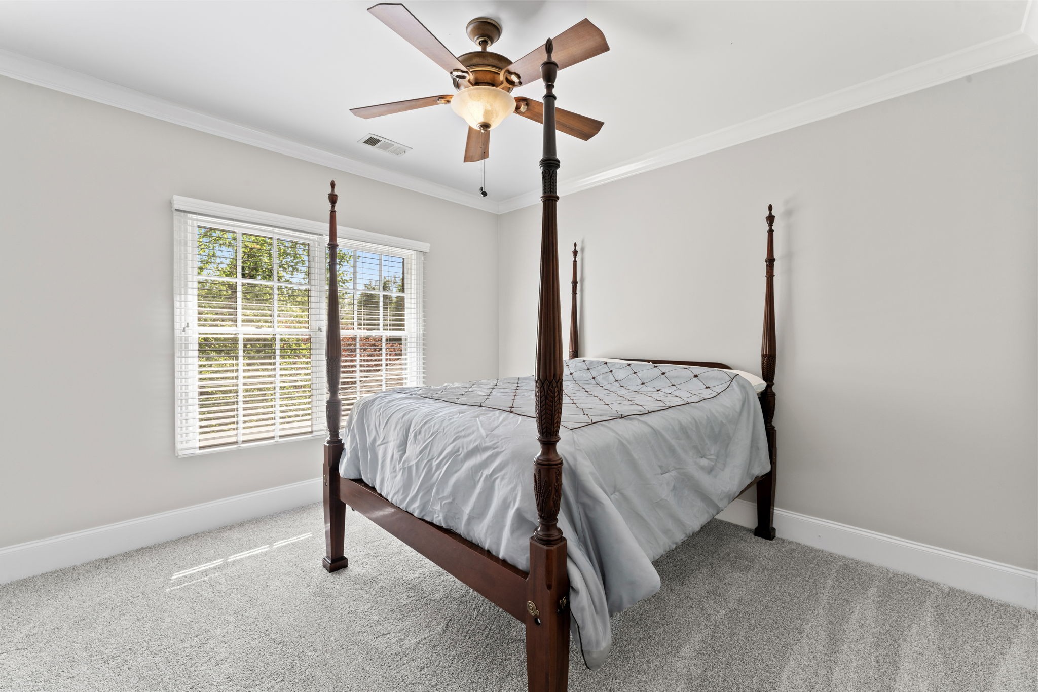 7402 Cold Harbor Court Fairview, TN 37062 - Photo 33 of 48 a bedroom with a bed and a window