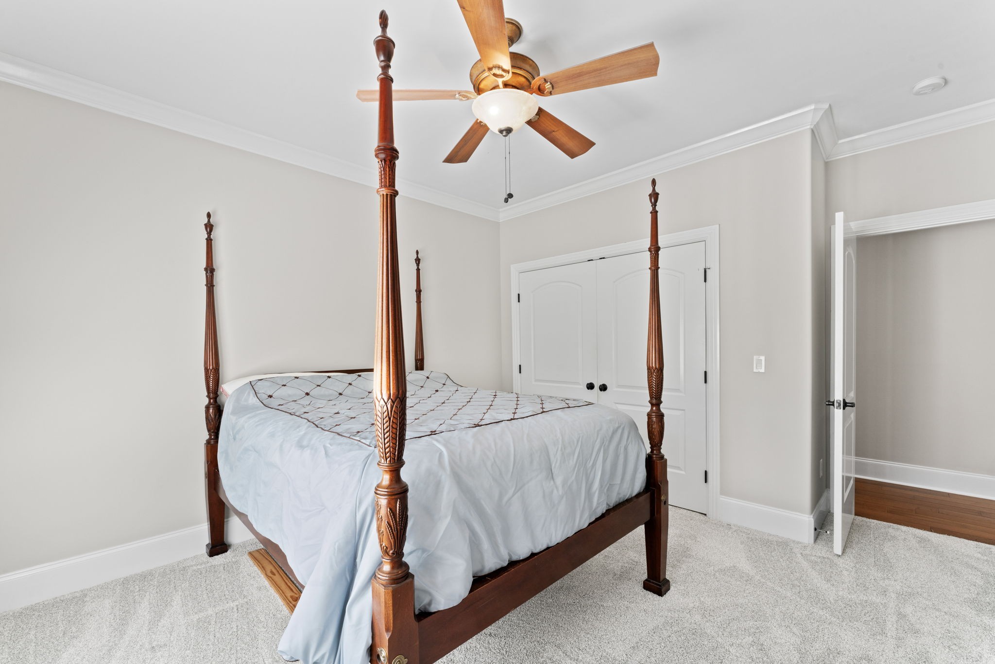 7402 Cold Harbor Court Fairview, TN 37062 - Photo 34 of 48 a bedroom with a bed and a chandelier fan
