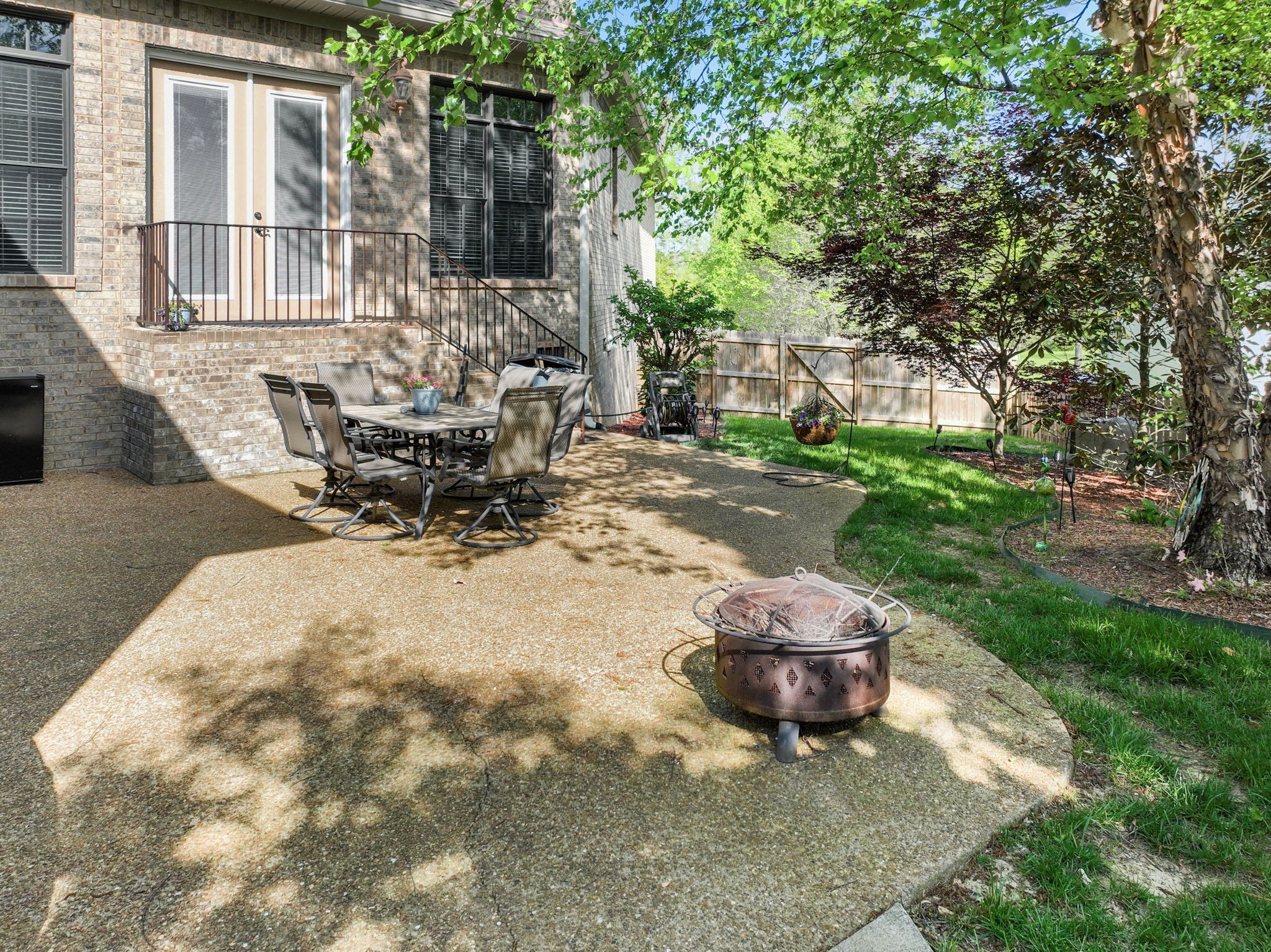 7402 Cold Harbor Court Fairview, TN 37062 - Photo 42 of 48 a view of a backyard with table and chairs and a fire pit