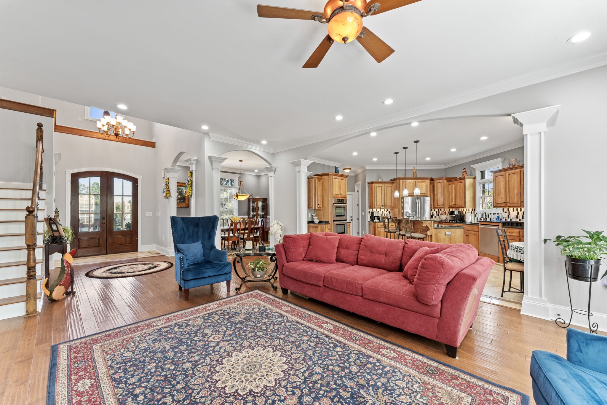 7402 Cold Harbor Court Fairview, TN 37062 - Photo 9 of 48 a living room with furniture ceiling fan and a rug