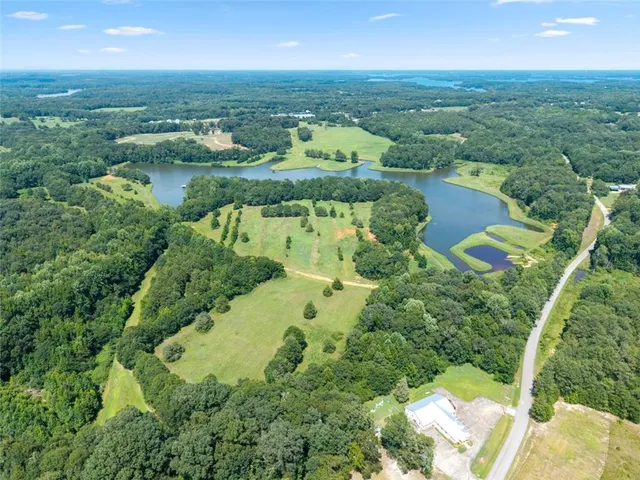 a view of lake with green space