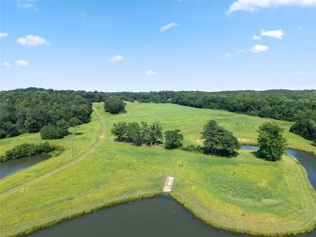 a front view of house with yard and outdoor seating