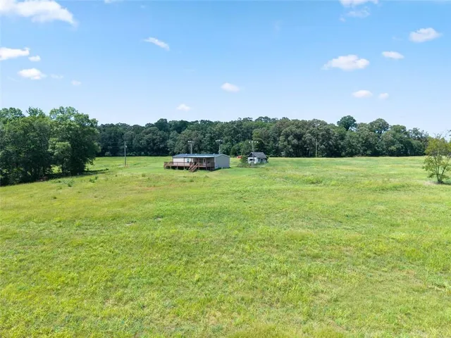 a view of outdoor space with deck and yard