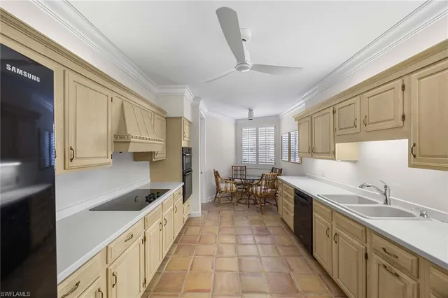 a large kitchen with a large window