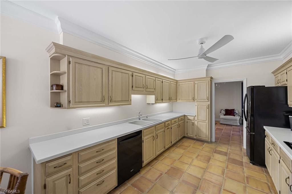 828 Hideaway Circle East, Unit 4434 Marco Island, FL 34145 - Photo 17 of 50 a kitchen with granite countertop a refrigerator and a sink