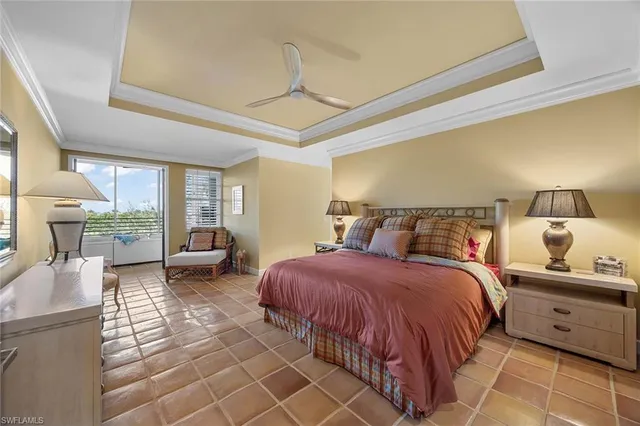 a bedroom with double bed and a couch