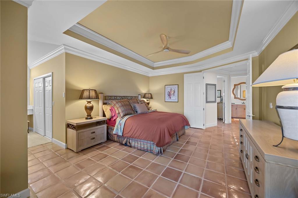 828 Hideaway Circle East, Unit 4434 Marco Island, FL 34145 - Photo 20 of 50 a spacious bedroom with a bed and wooden floor