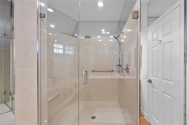 a bathroom with a shower and a mirror