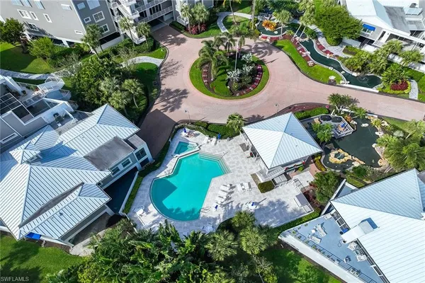 an aerial view of a house with garden space and street view