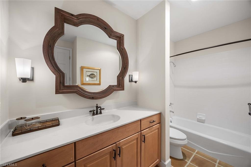 828 Hideaway Circle East, Unit 4434 Marco Island, FL 34145 - Photo 29 of 50 a bathroom with a sink and a mirror