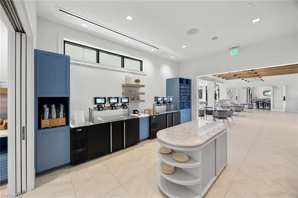 a kitchen with a stove a refrigerator and a sink