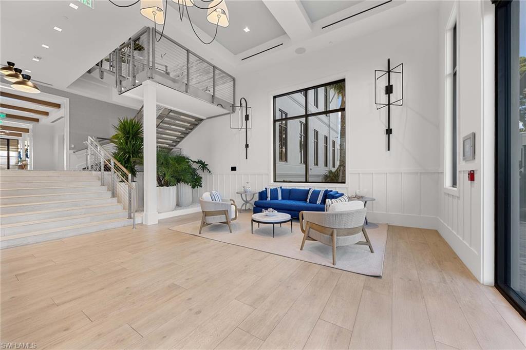 828 Hideaway Circle East, Unit 4434 Marco Island, FL 34145 - Photo 36 of 50 a living room with furniture and a large window
