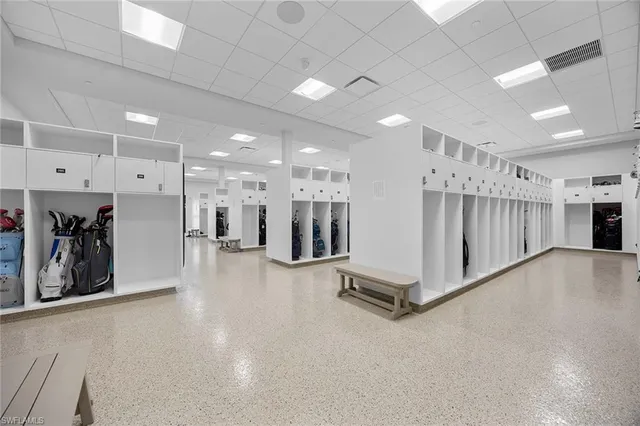 a view of a hall with wooden floor