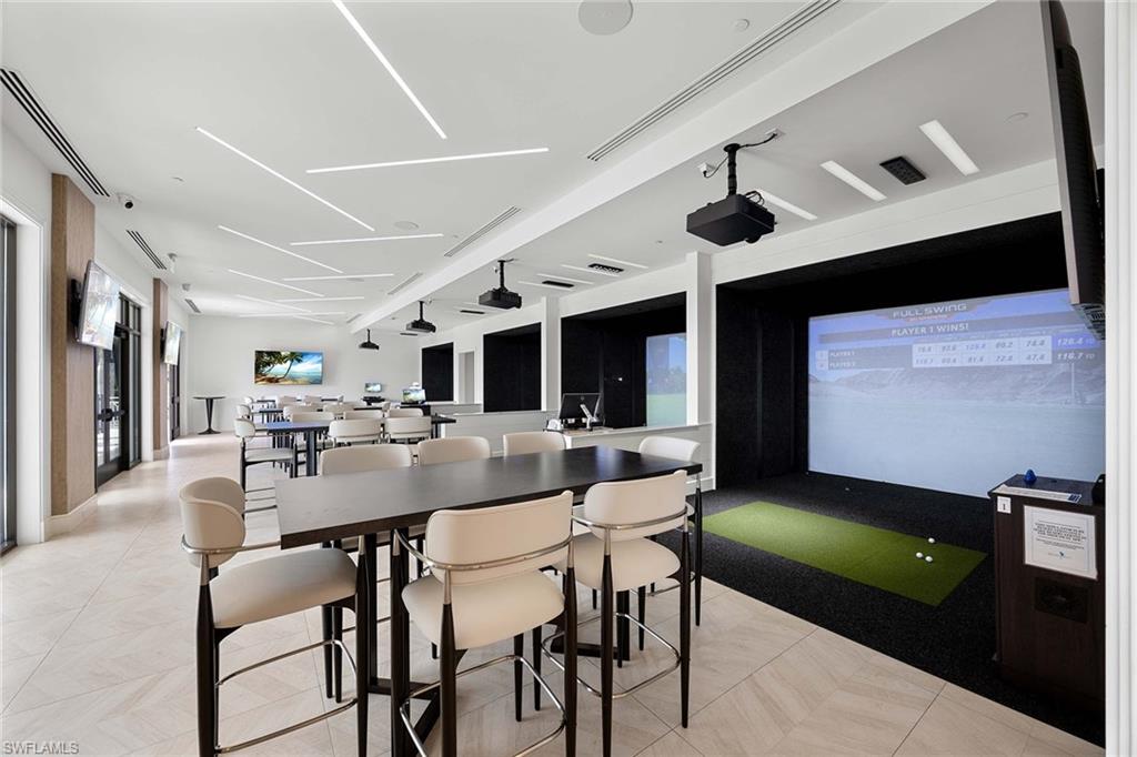 828 Hideaway Circle East, Unit 4434 Marco Island, FL 34145 - Photo 43 of 50 a view of a dining room with furniture and wooden floor