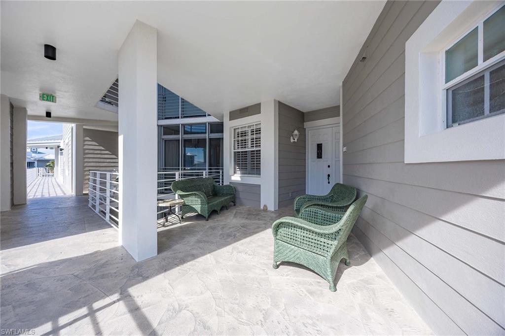 828 Hideaway Circle East, Unit 4434 Marco Island, FL 34145 - Photo 8 of 50 a living room with furniture and a wooden floor