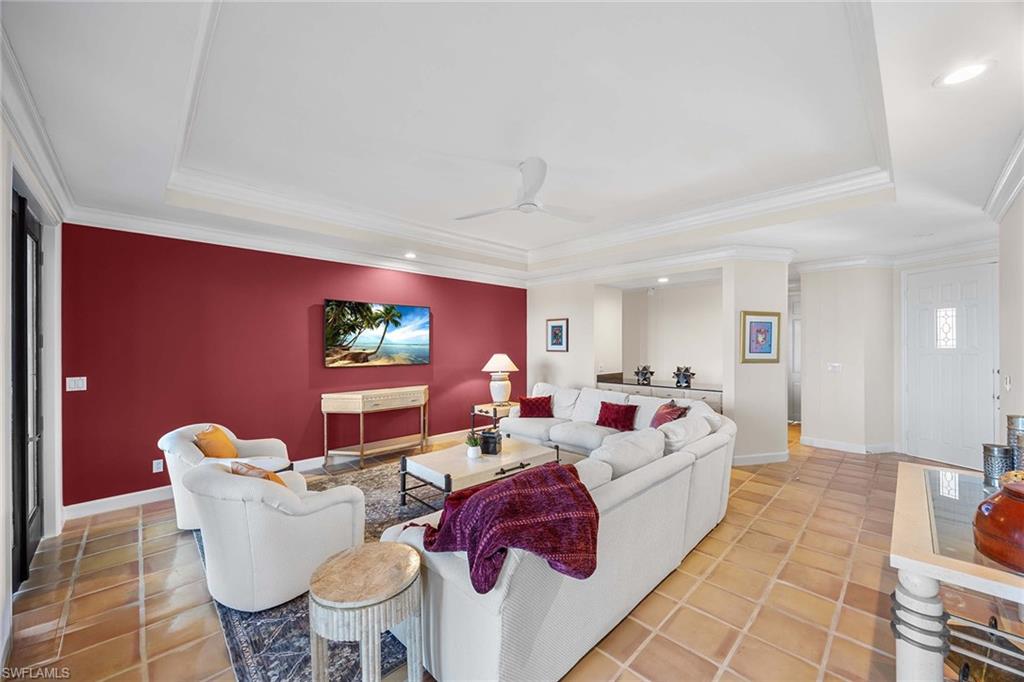 828 Hideaway Circle East, Unit 4434 Marco Island, FL 34145 - Photo 10 of 50 a living room with furniture and a flat screen tv