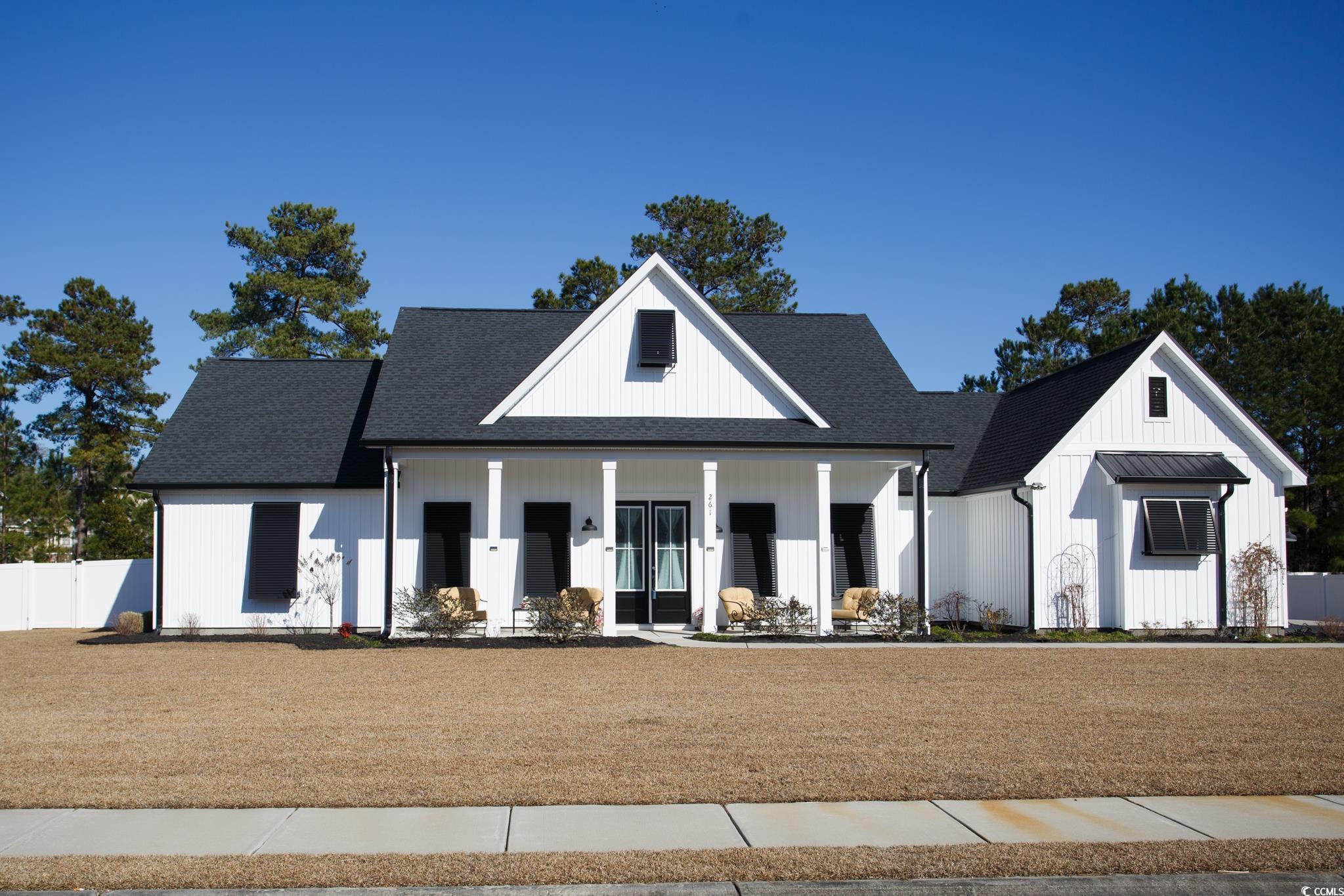 261 Marsh Tacky Loop Myrtle Beach, SC 29588 - Photo 2 of 40 Modern inspired farmhouse with a porch