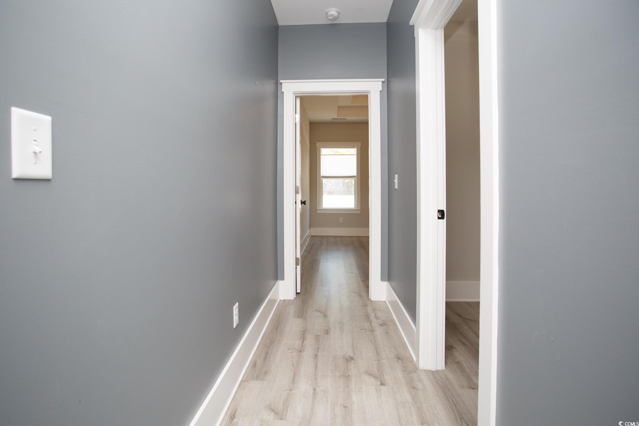 261 Marsh Tacky Loop Myrtle Beach, SC 29588 - Photo 27 of 40 Hall with light hardwood / wood-style flooring
